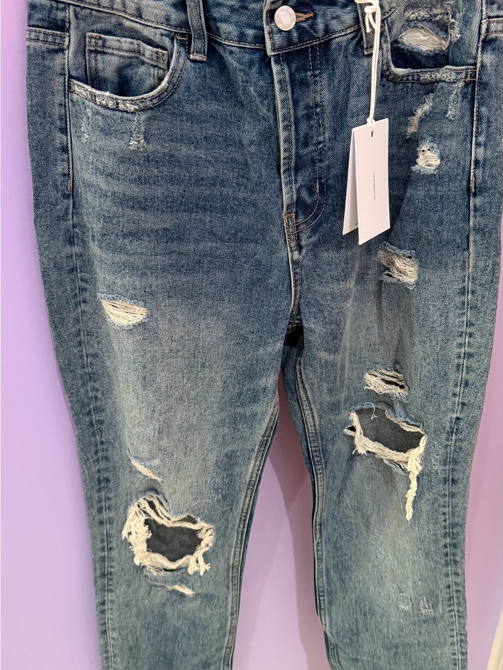 Super High-Rise Straight distressed jeans.